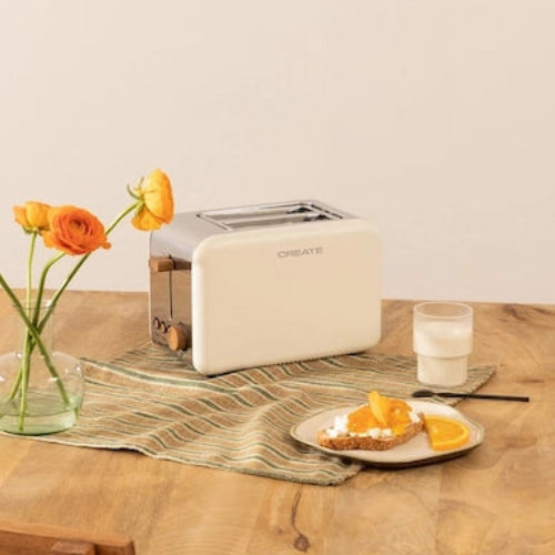 CREATE TOAST RETRO off-white toaster on wooden dining table with breakfast setup