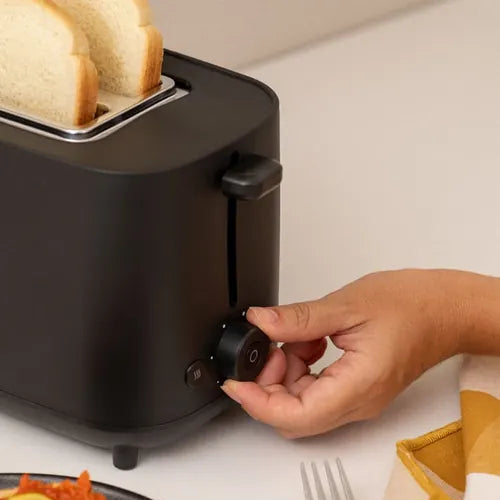 CREATE black toaster close up with adjustable browning dial and control buttons