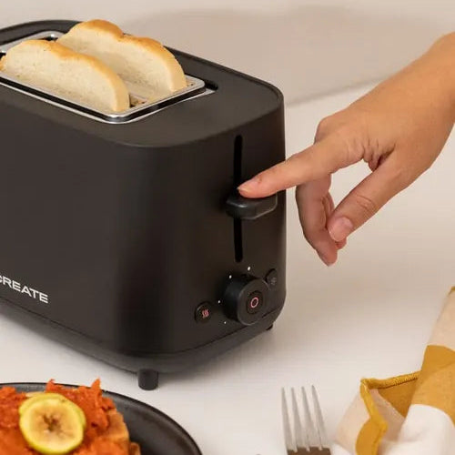 CREATE black bread toaster side view showing lever control and toast slices