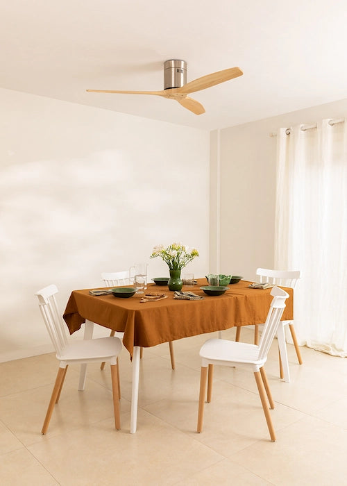 create ceiling fan view in a dining room with a table set for a meal.