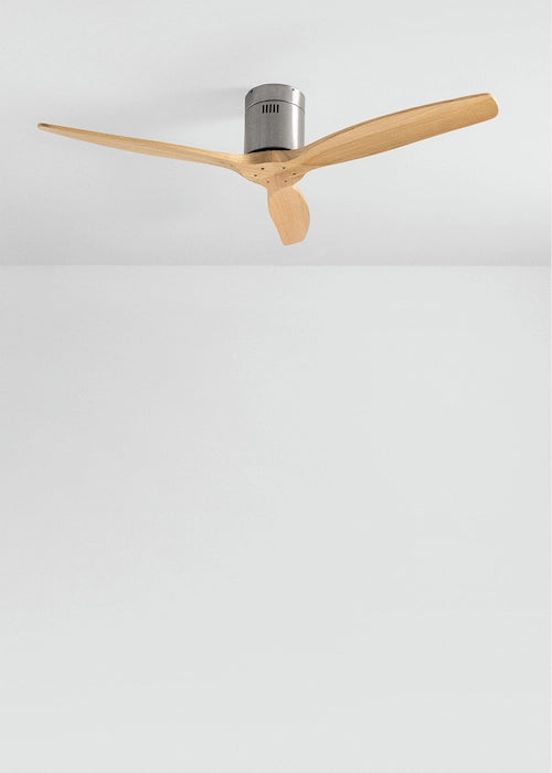 Ceiling fan of silver and light-brown colors with wooden blades on a white ceiling